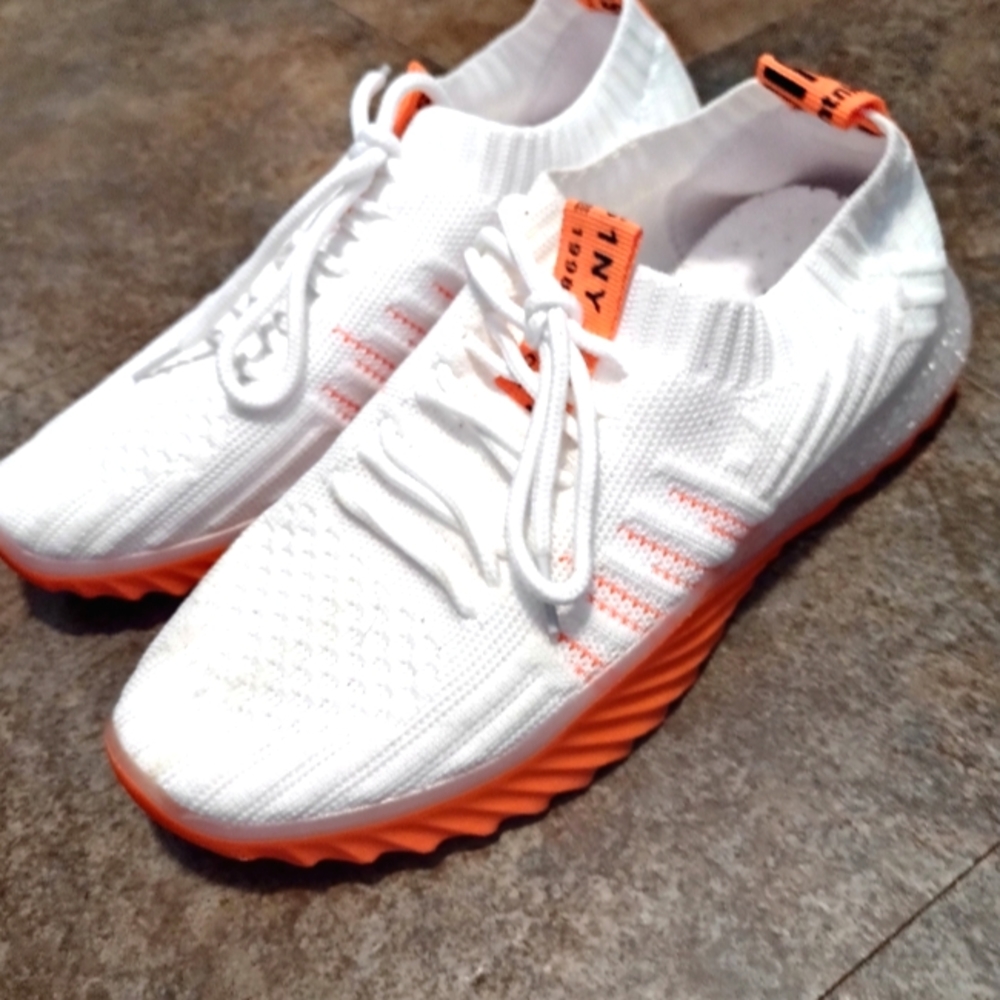 White and bright orange shoes